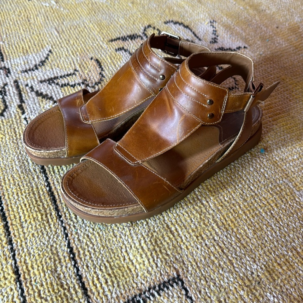 Cat (caterpillar, Inc.) brown leather sandals.